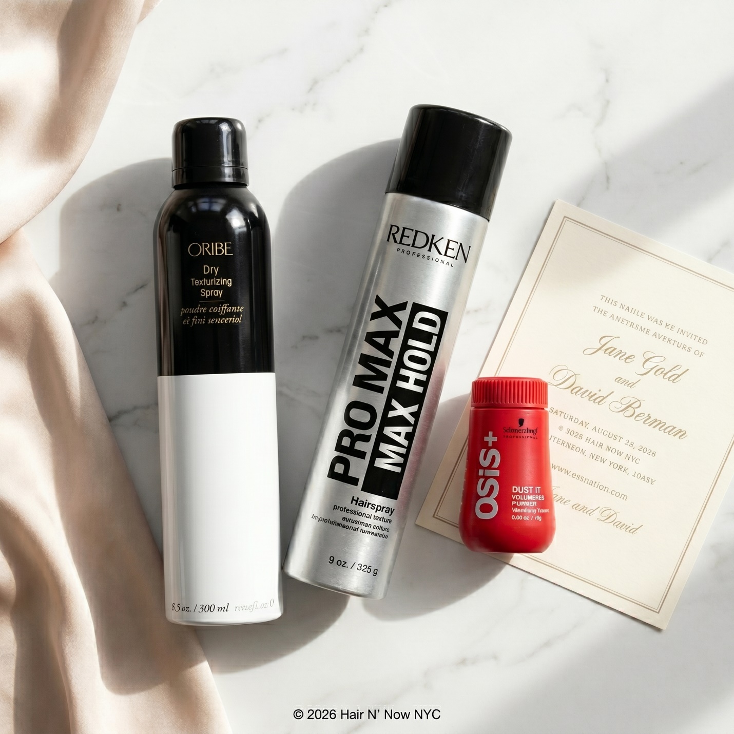 Professional wedding hair prep product flat lay featuring Oribe Dry Texturizing Spray, Redken Max Hold Hairspray, and Schwarzkopf OSiS Dust It.